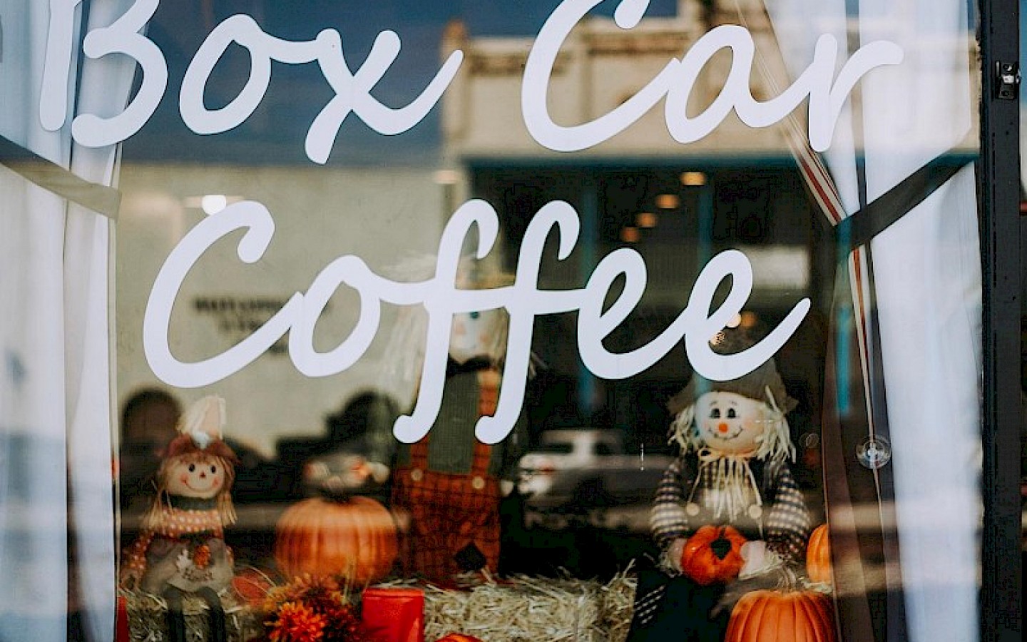 front glass with window display of a local coffee shop