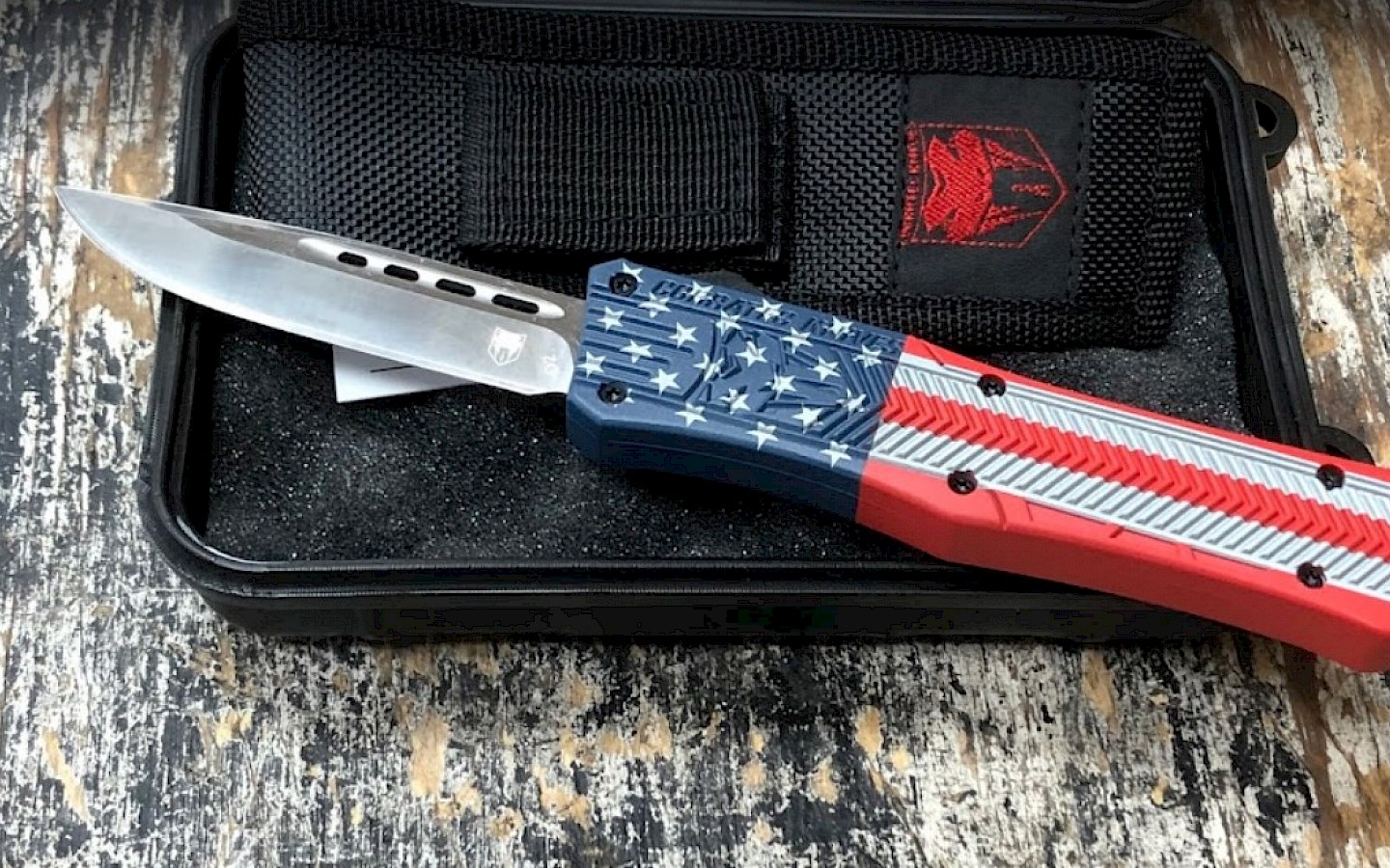 a folding pocket knife with an American flag handle design