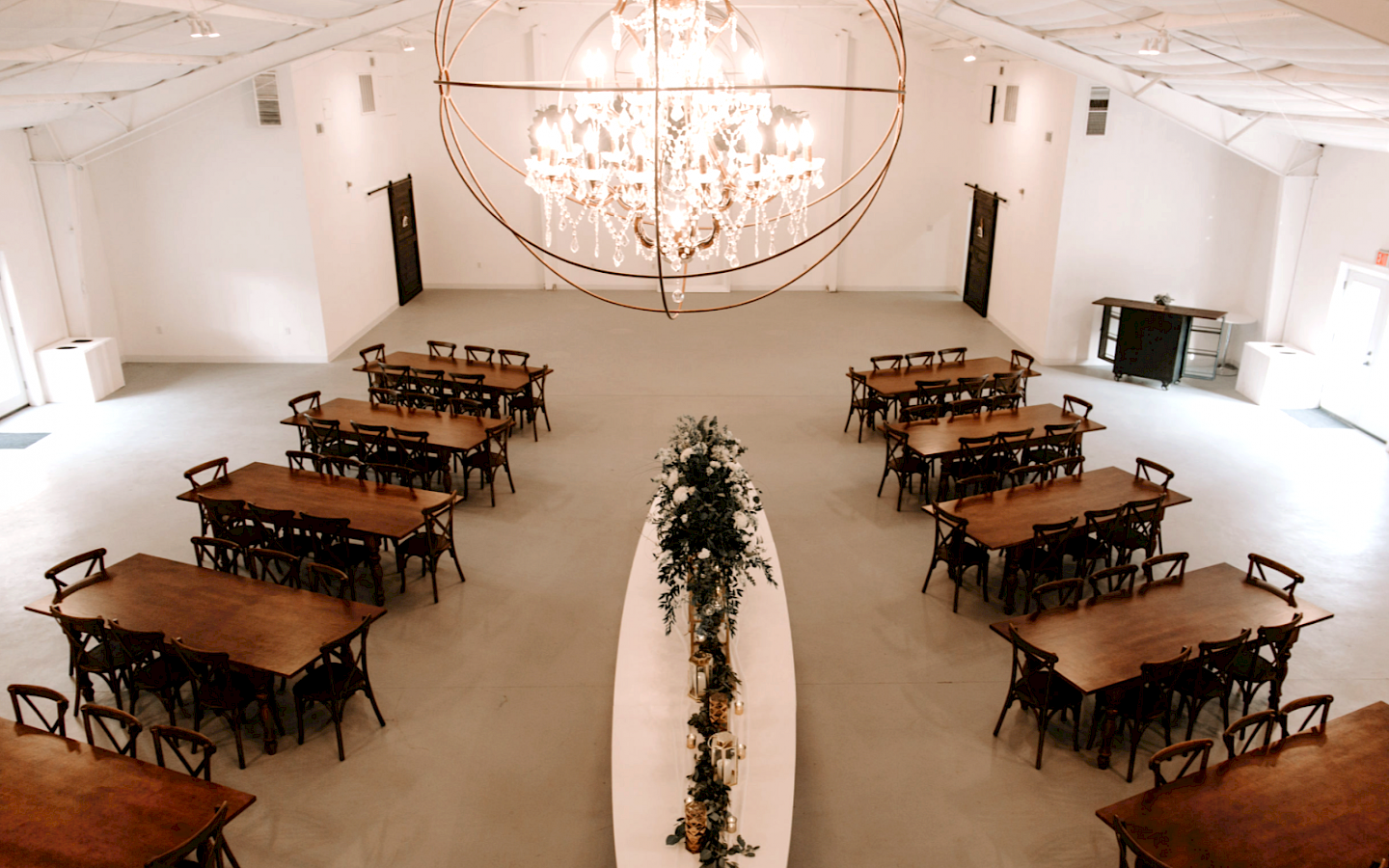 inside of a building, decorated with formal chairs and tables