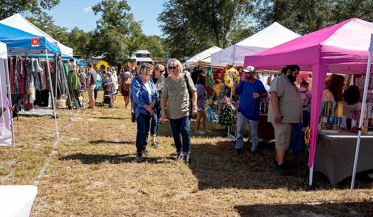 vendors set up in rows with guests walking in between