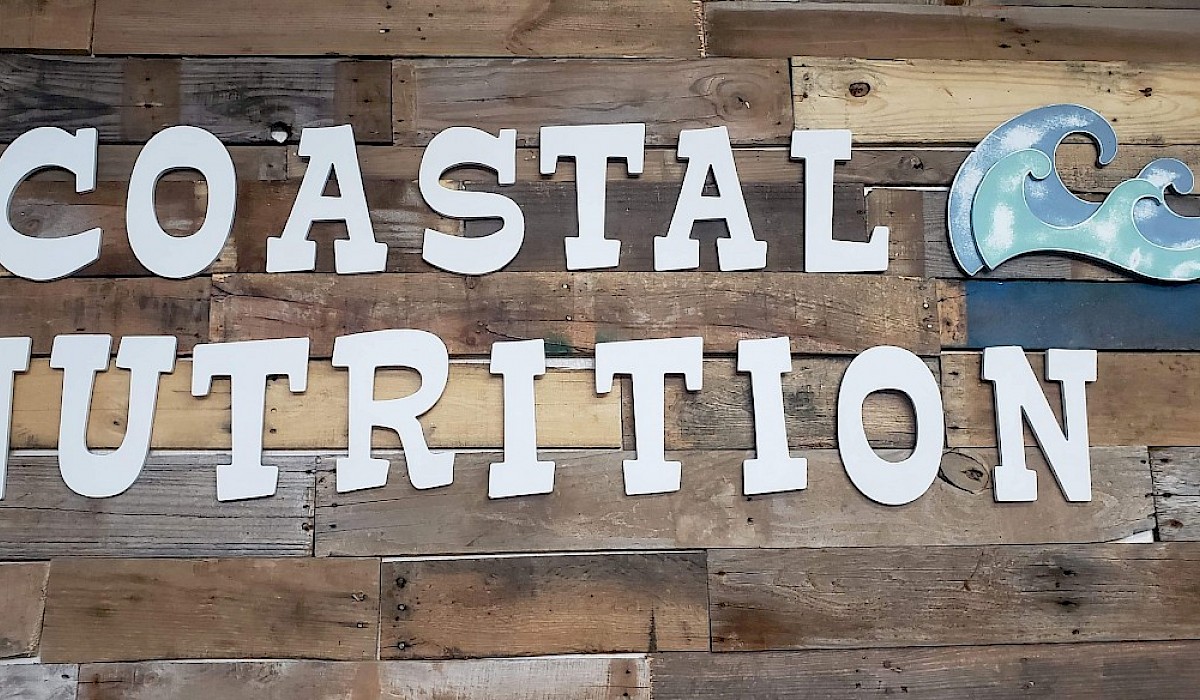 branded logo on a wood planked wall in a health shake shop