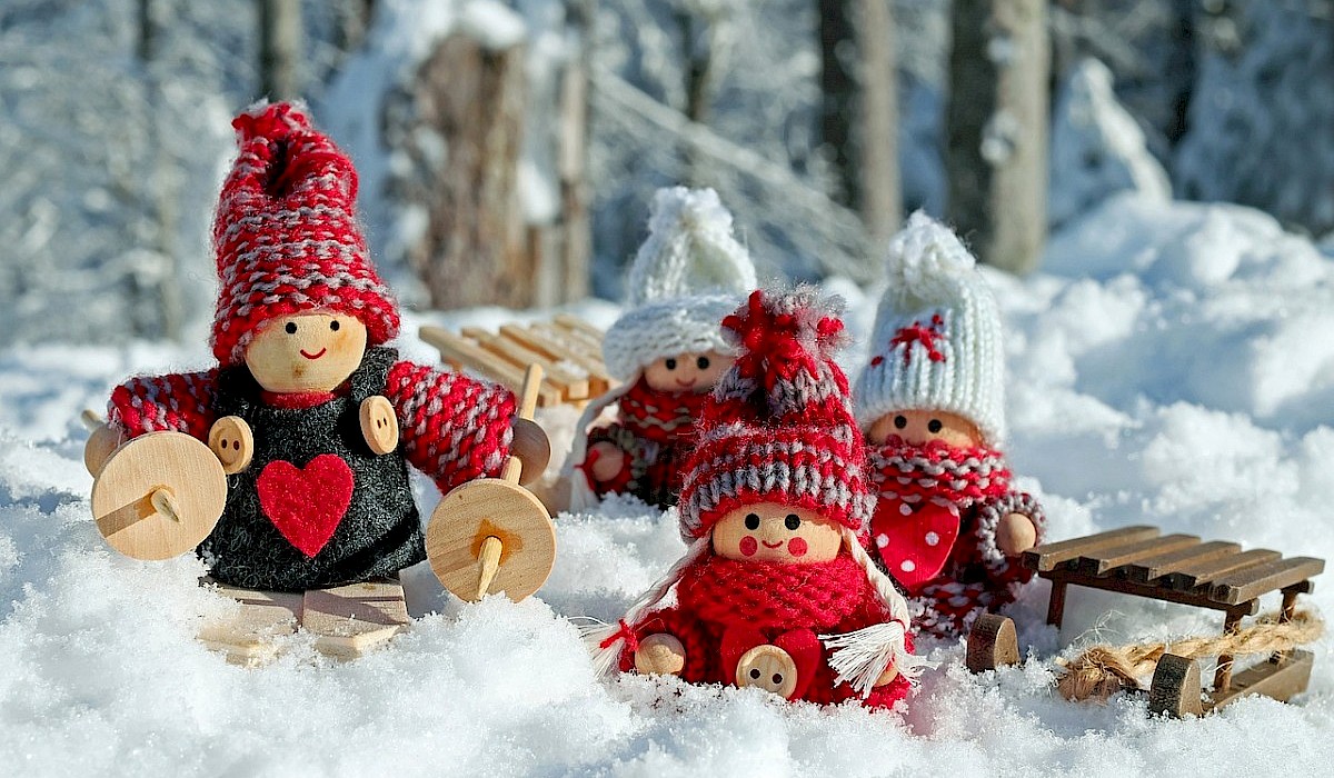 christmas dolls arranged in snow