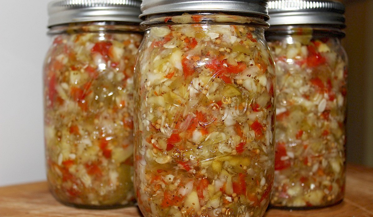 fresh vegetables in mason jars on a shelf